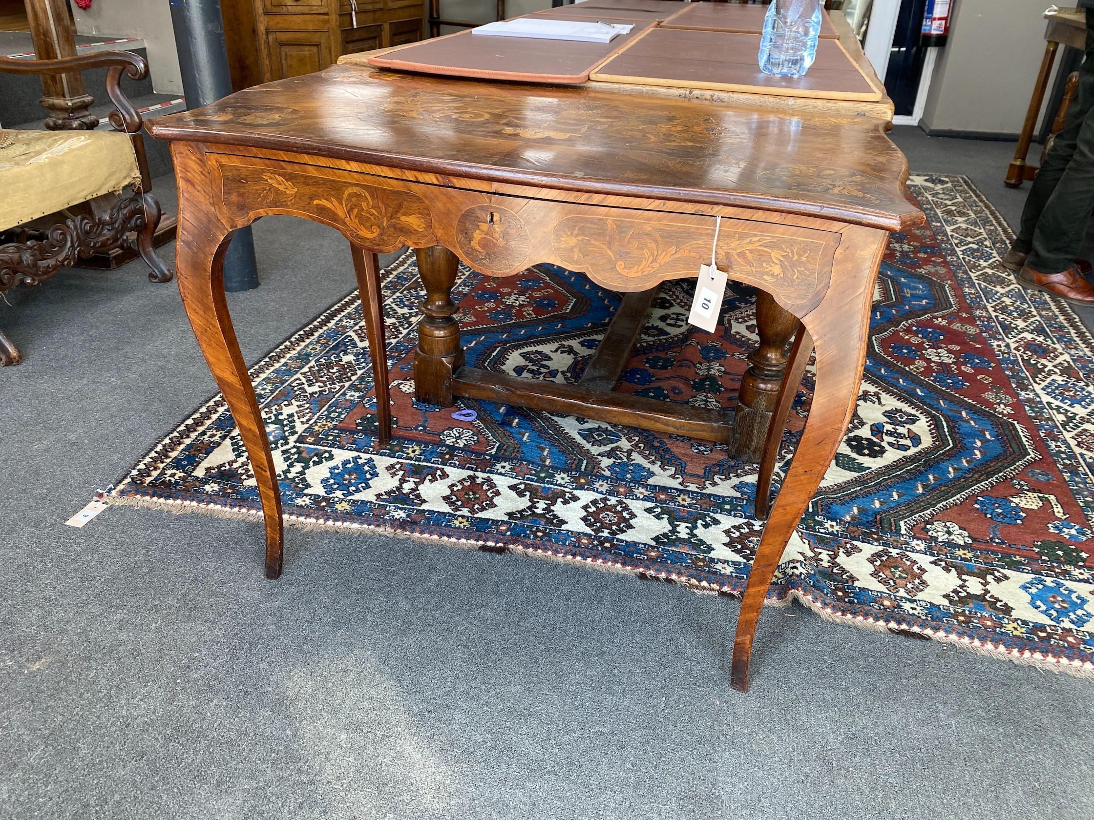 A Victorian walnut and marquetry inlaid rectangular serpentine centre table, width 90cm, depth 52cm, height 75cm